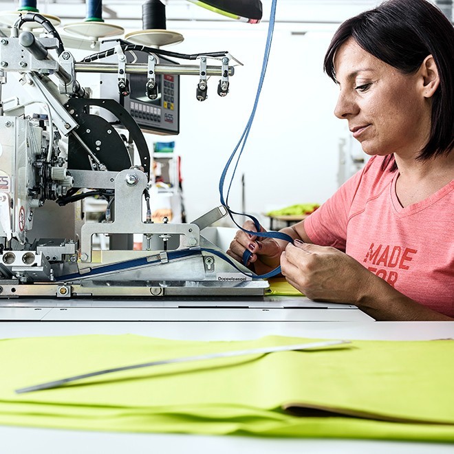 Woman working on machine.